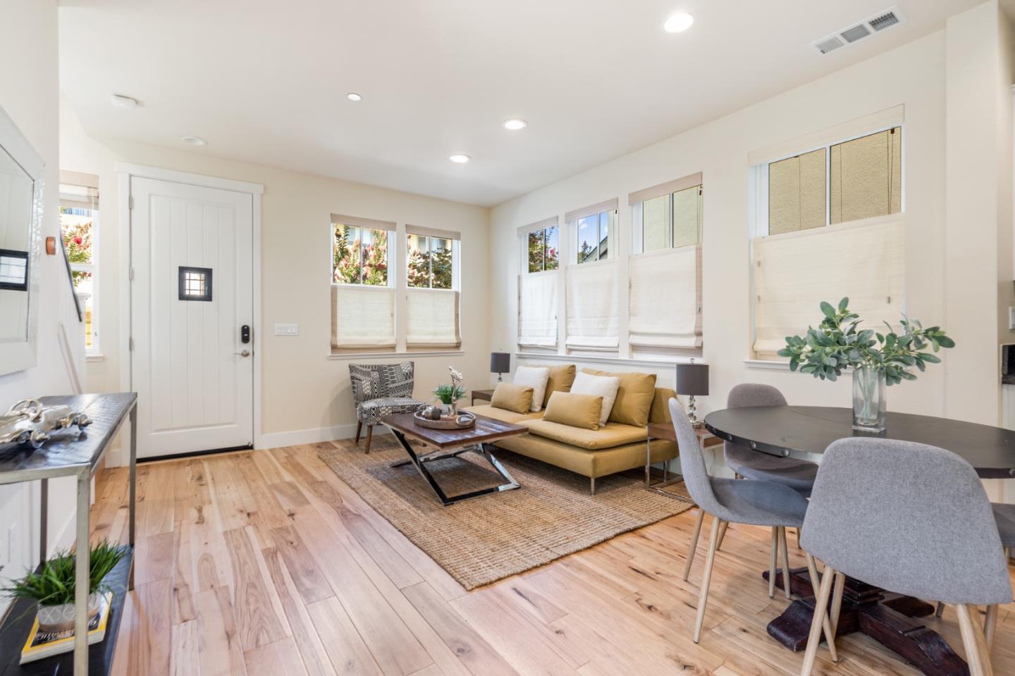 100 Tilton Avenue San Mateo, CA 94401 - Photo 4 of 23 a living room with furniture or wooden floor and a potted plant