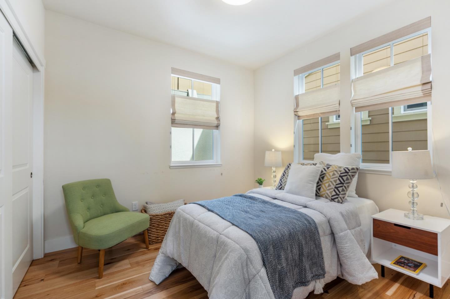 100 Tilton Avenue San Mateo, CA 94401 - Photo 8 of 23 a bedroom with a bed a chair and a window