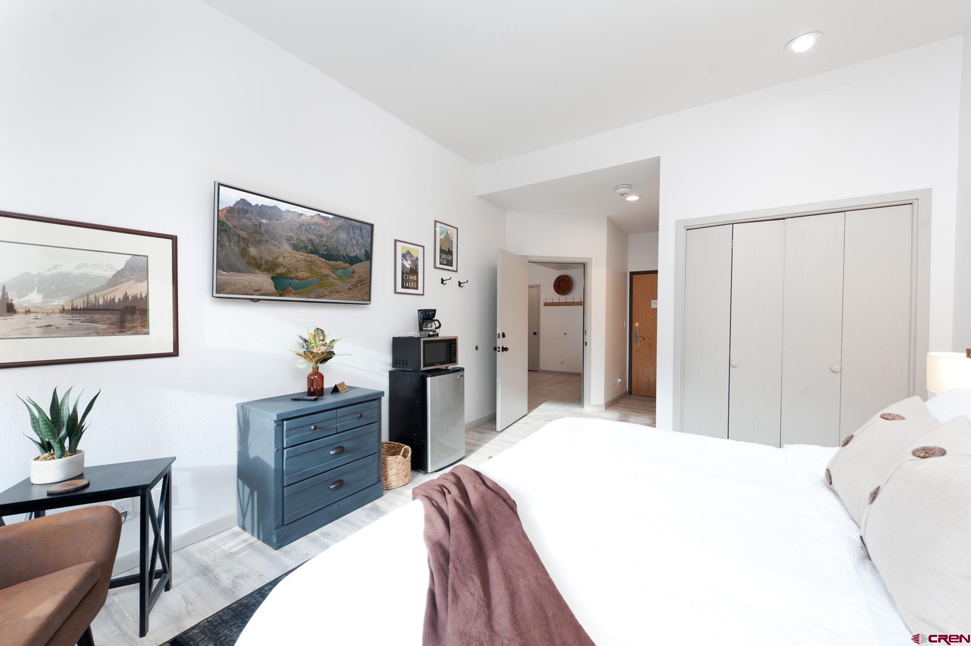 93 Needles Way, Unit 501 Durango, CO 81301 - Photo 20 of 32 a bedroom with a bed and a flat screen tv