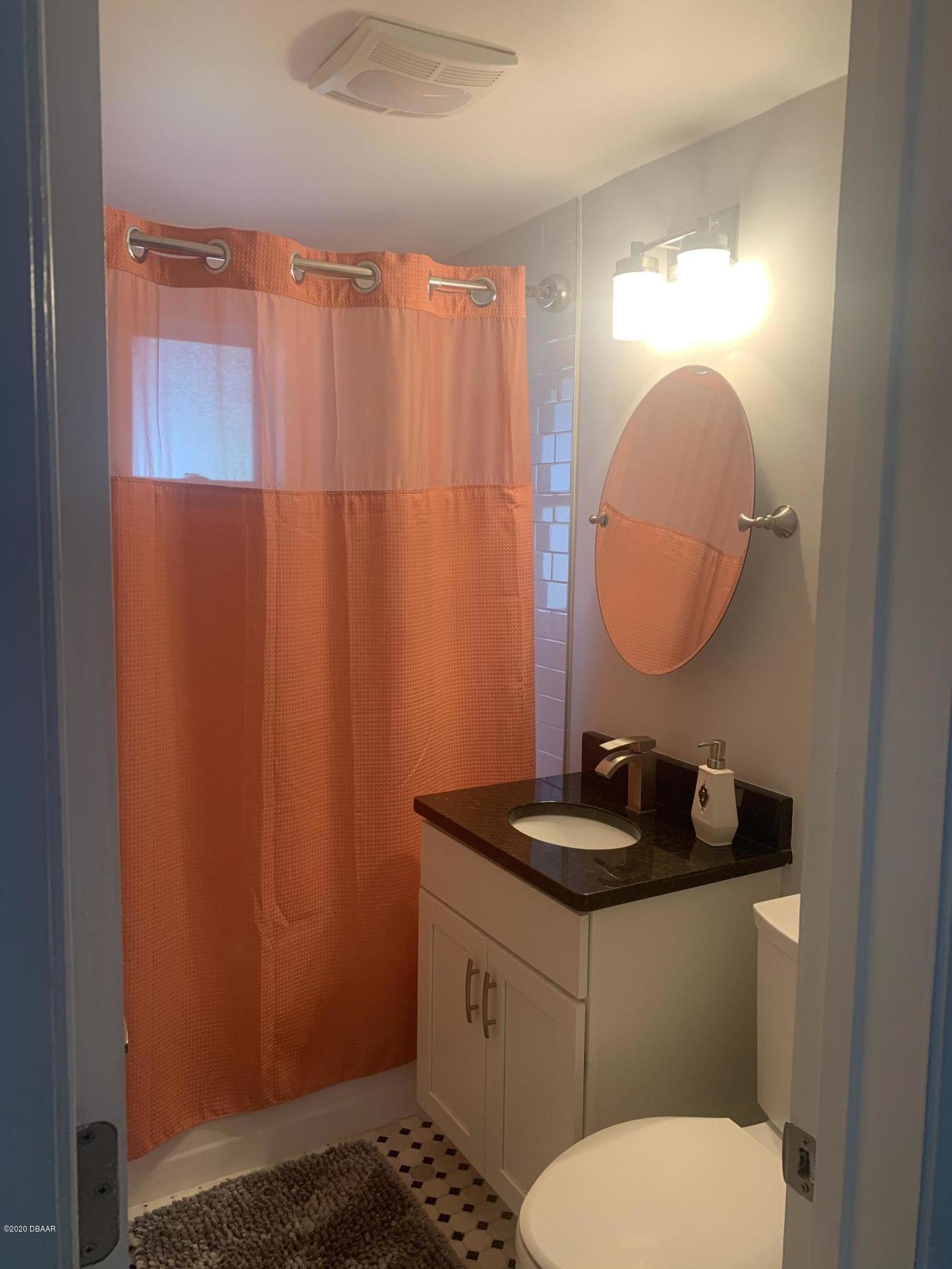 109 Floridana Road DeBary, FL 32713 - Photo 11 of 38 a bathroom with a sink and a mirror