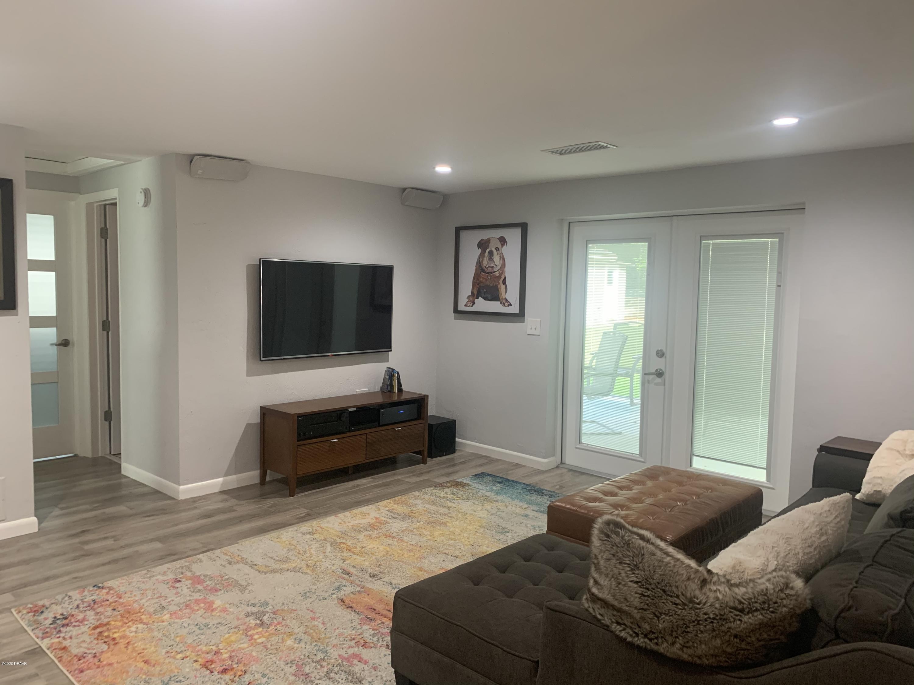 109 Floridana Road DeBary, FL 32713 - Photo 12 of 38 a living room with furniture and a flat screen tv
