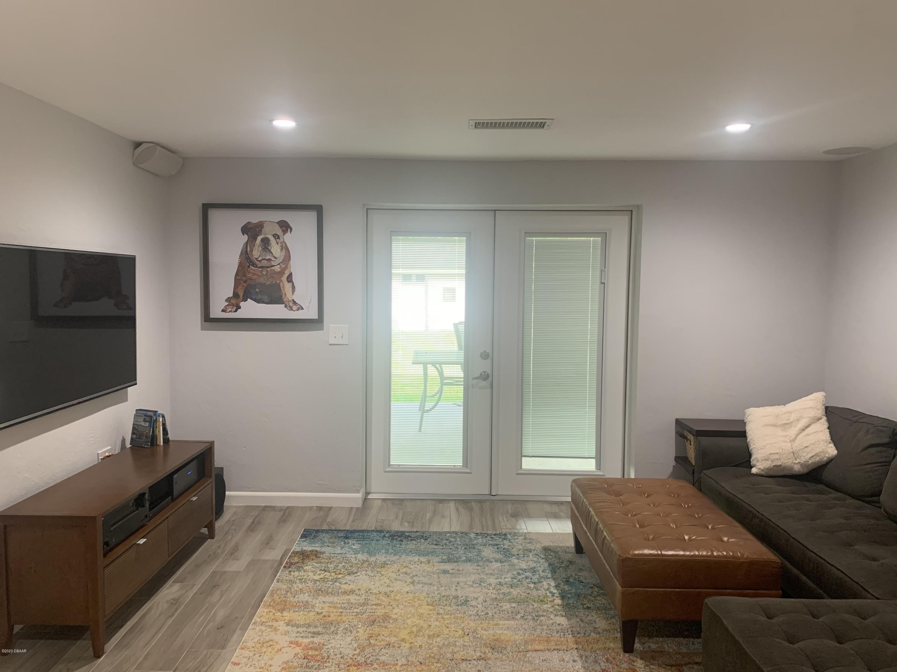 109 Floridana Road DeBary, FL 32713 - Photo 13 of 38 a living room with furniture and a flat screen tv