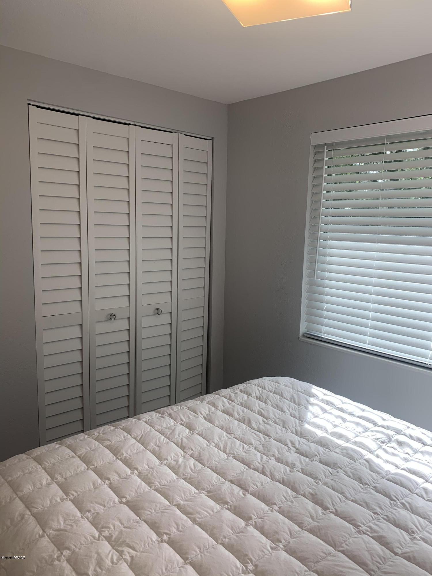 109 Floridana Road DeBary, FL 32713 - Photo 16 of 38 a bedroom with a bed and a window