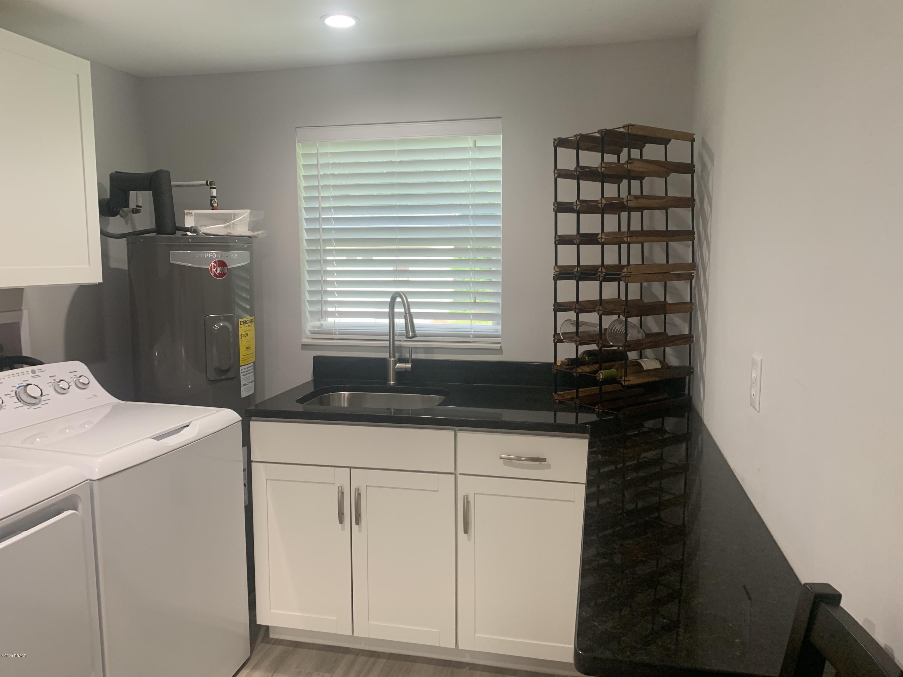 109 Floridana Road DeBary, FL 32713 - Photo 20 of 38 a room with dryer and washer