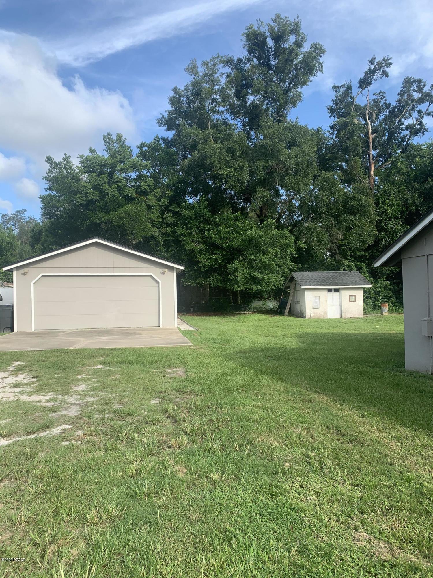 109 Floridana Road DeBary, FL 32713 - Photo 28 of 38 a view of a back yard of the house