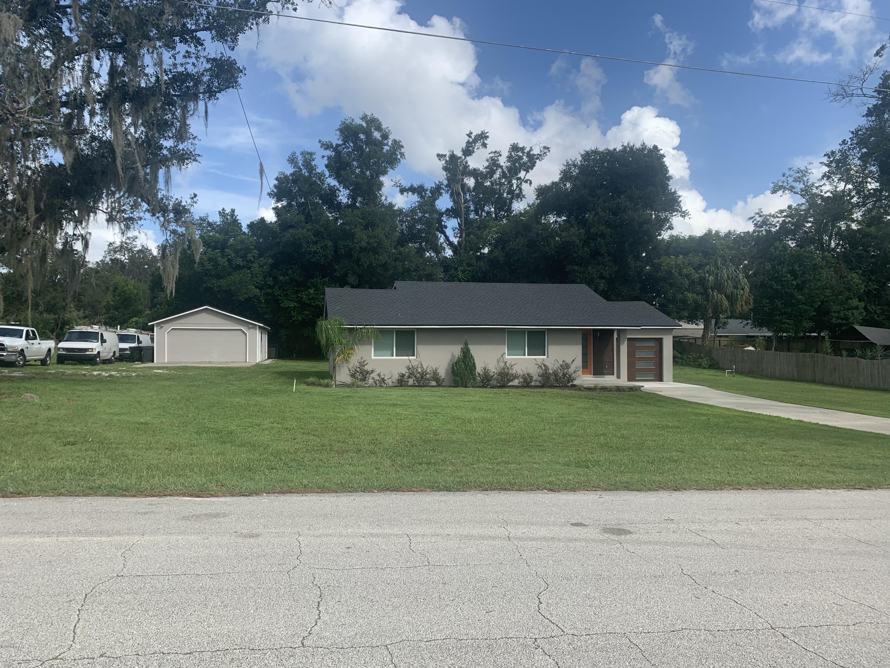 109 Floridana Road DeBary, FL 32713 - Photo 3 of 38 a front view of a house with a garden