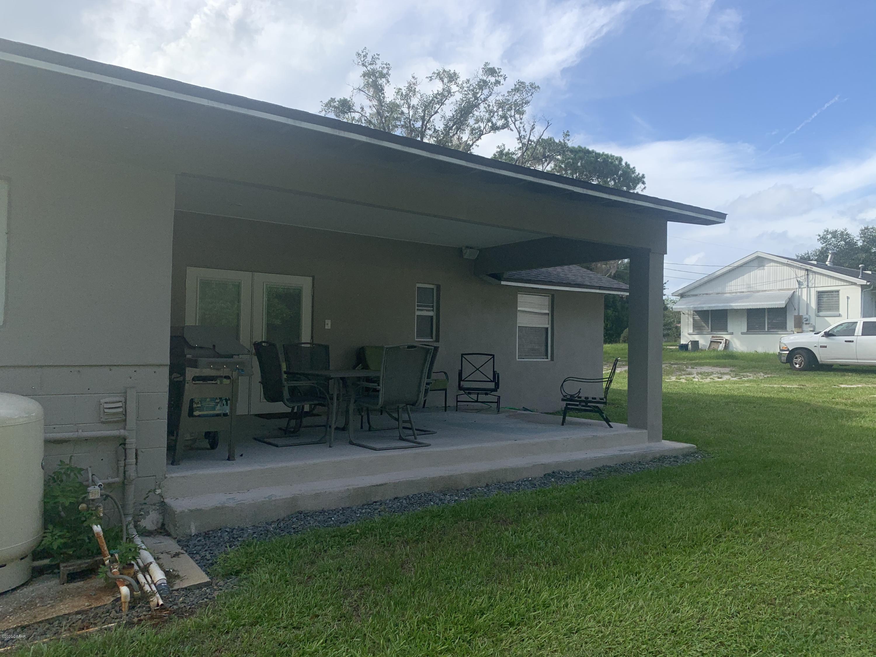 109 Floridana Road DeBary, FL 32713 - Photo 31 of 38 a view of a house with patio