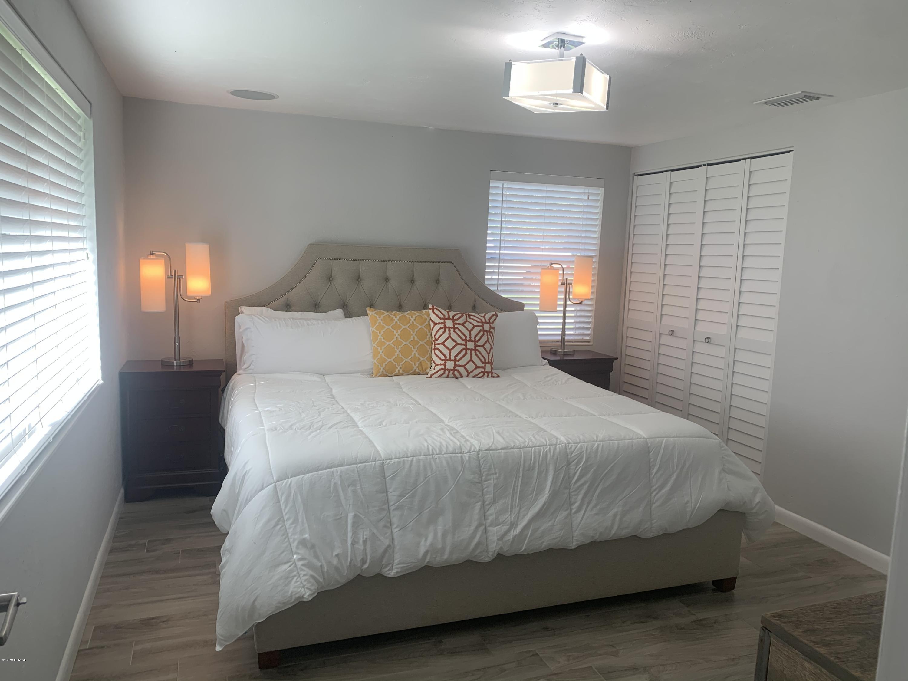 109 Floridana Road DeBary, FL 32713 - Photo 5 of 38 a bedroom with a bed and window