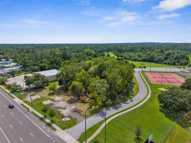 a view of a yard with an outdoor seating