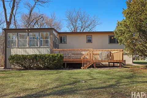 a view of a yard with a tree