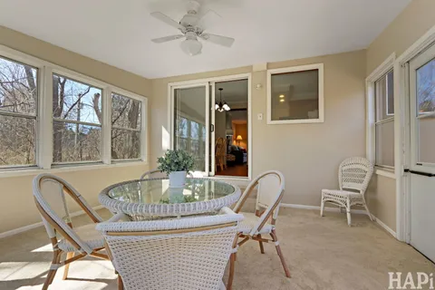 a dining room with furniture and window