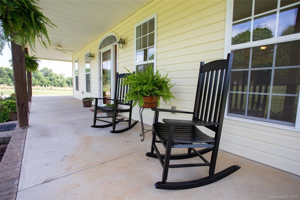 122 Barrier Farms Road Midland, NC 28107 - Photo 2 of 33 a view of a chairs and table in patio