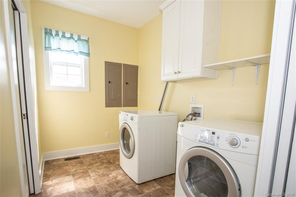122 Barrier Farms Road Midland, NC 28107 - Photo 12 of 33 a view of storage and utility room with washer and dryer