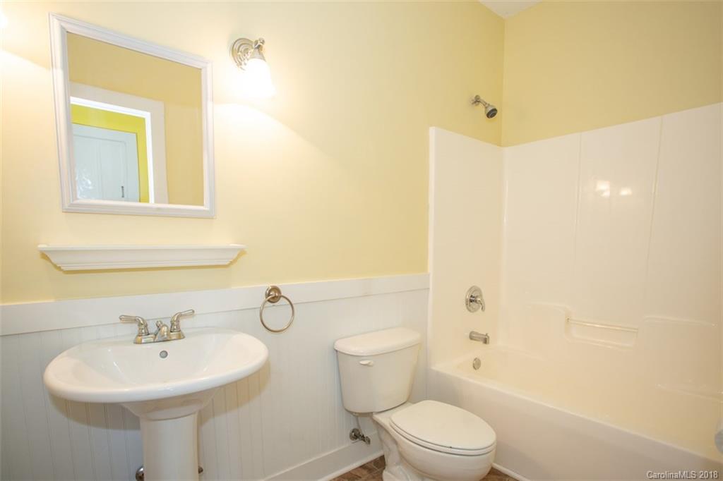 122 Barrier Farms Road Midland, NC 28107 - Photo 14 of 33 a bathroom with a sink a toilet and shower