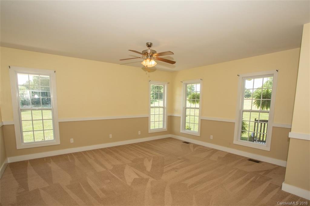 122 Barrier Farms Road Midland, NC 28107 - Photo 21 of 33 a view of an empty room with a window