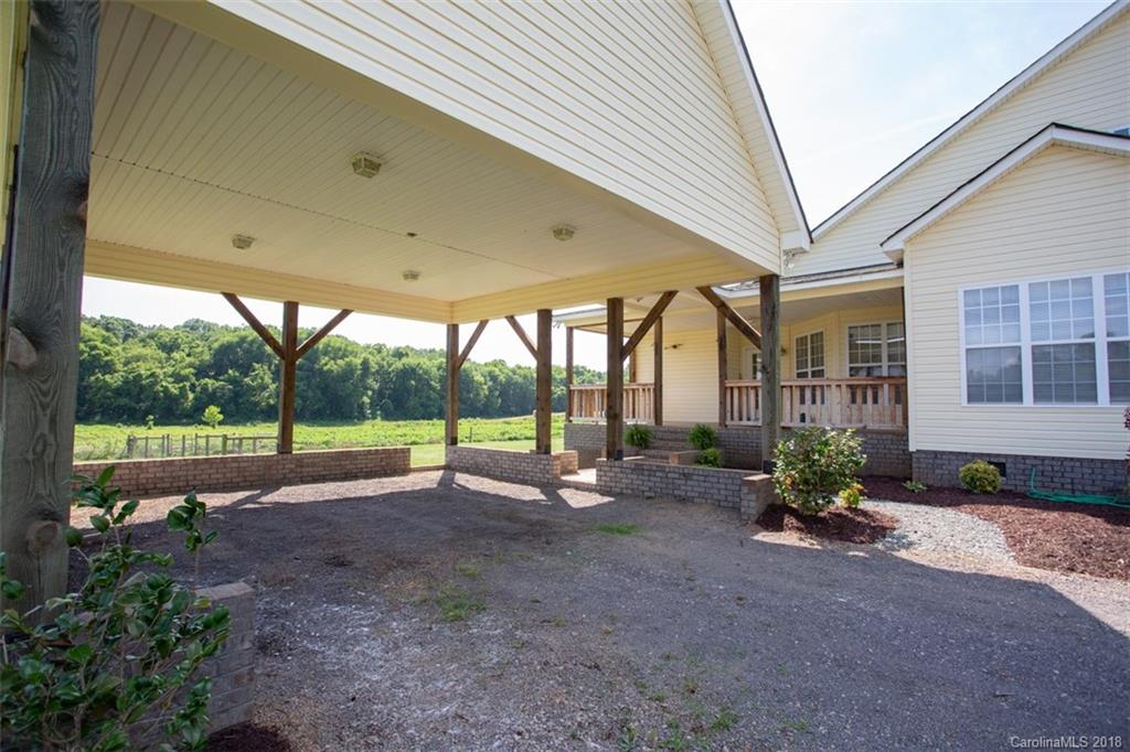 122 Barrier Farms Road Midland, NC 28107 - Photo 25 of 33 a view of outdoor space with porch and furniture