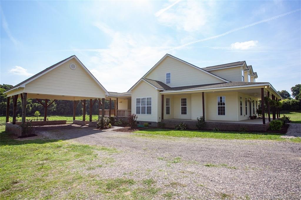 122 Barrier Farms Road Midland, NC 28107 - Photo 26 of 33 a front view of a house with a yard and trees