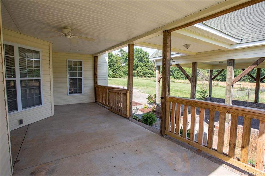122 Barrier Farms Road Midland, NC 28107 - Photo 27 of 33 a view of a porch with wooden floor and roof