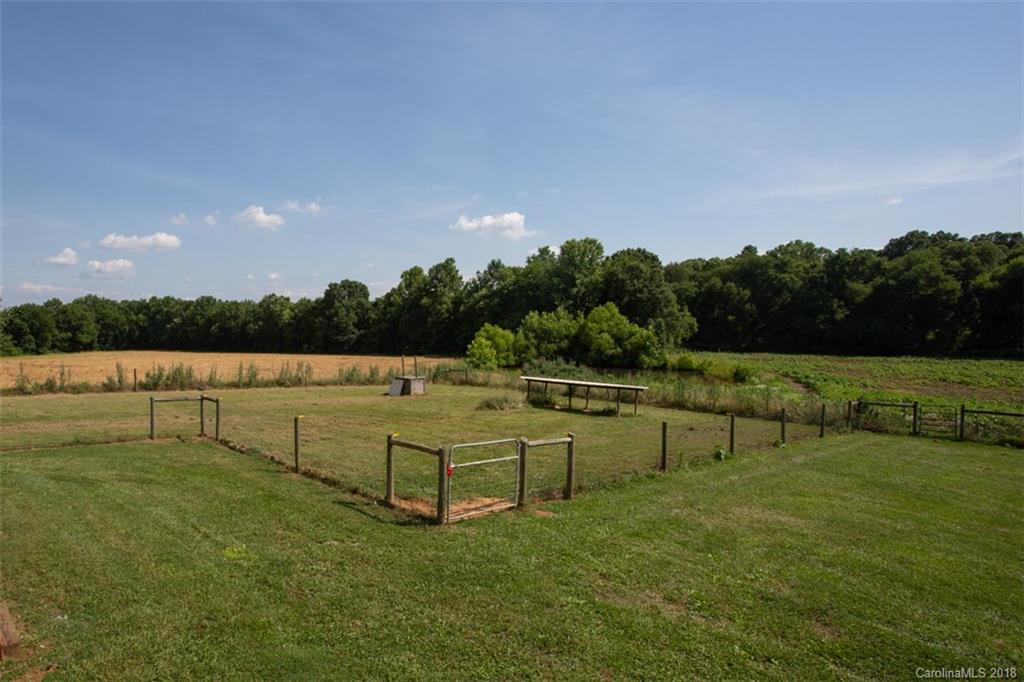 122 Barrier Farms Road Midland, NC 28107 - Photo 28 of 33 a view of a lake with houses in the background