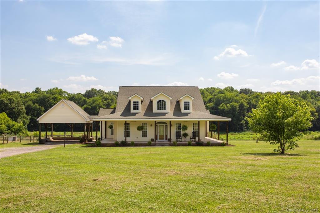 122 Barrier Farms Road Midland, NC 28107 - Photo 33 of 33 a front view of a house with swimming pool and yard