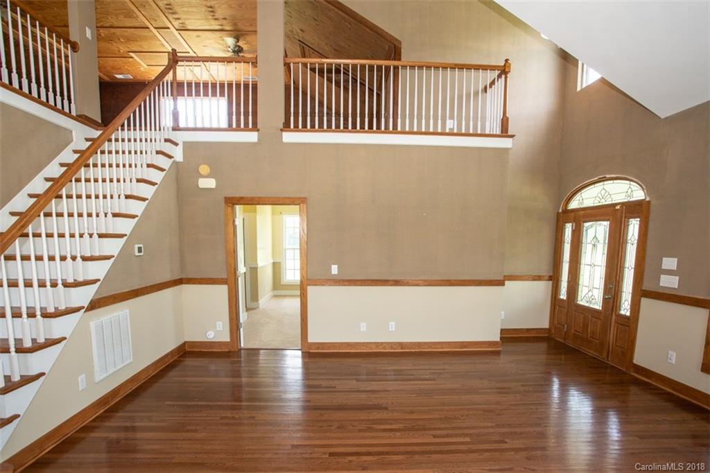 122 Barrier Farms Road Midland, NC 28107 - Photo 5 of 33 a view of an entryway with wooden floor and staircase
