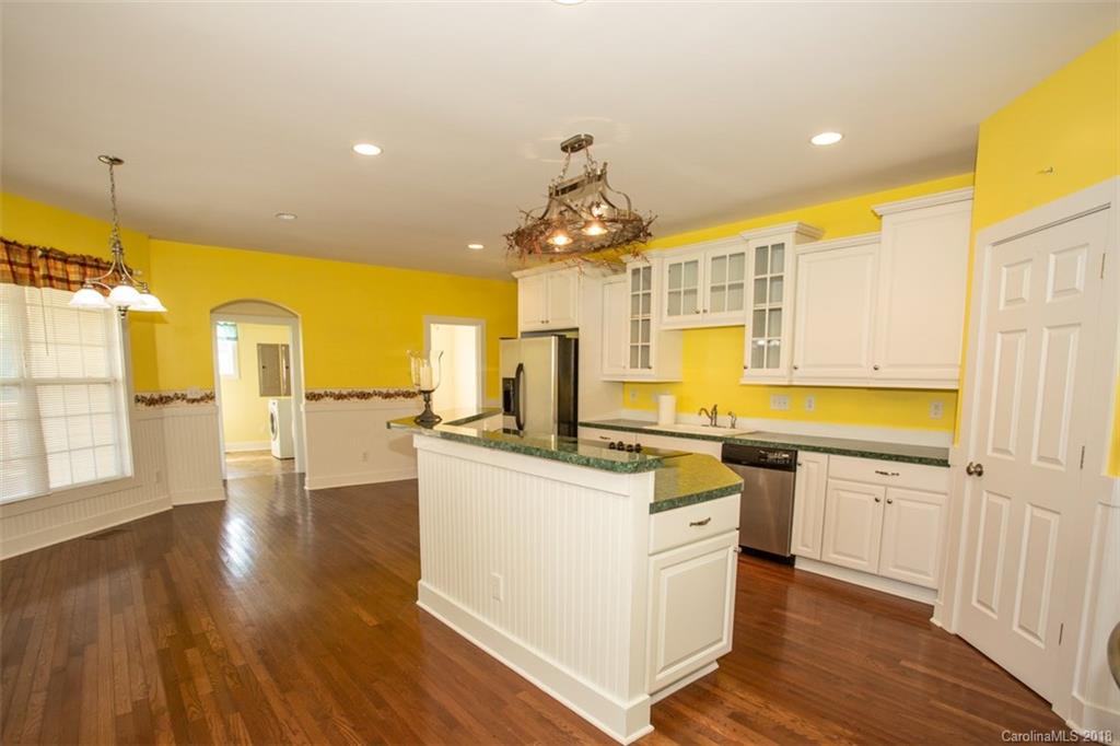 122 Barrier Farms Road Midland, NC 28107 - Photo 7 of 33 a kitchen with stainless steel appliances granite countertop a sink stove and refrigerator