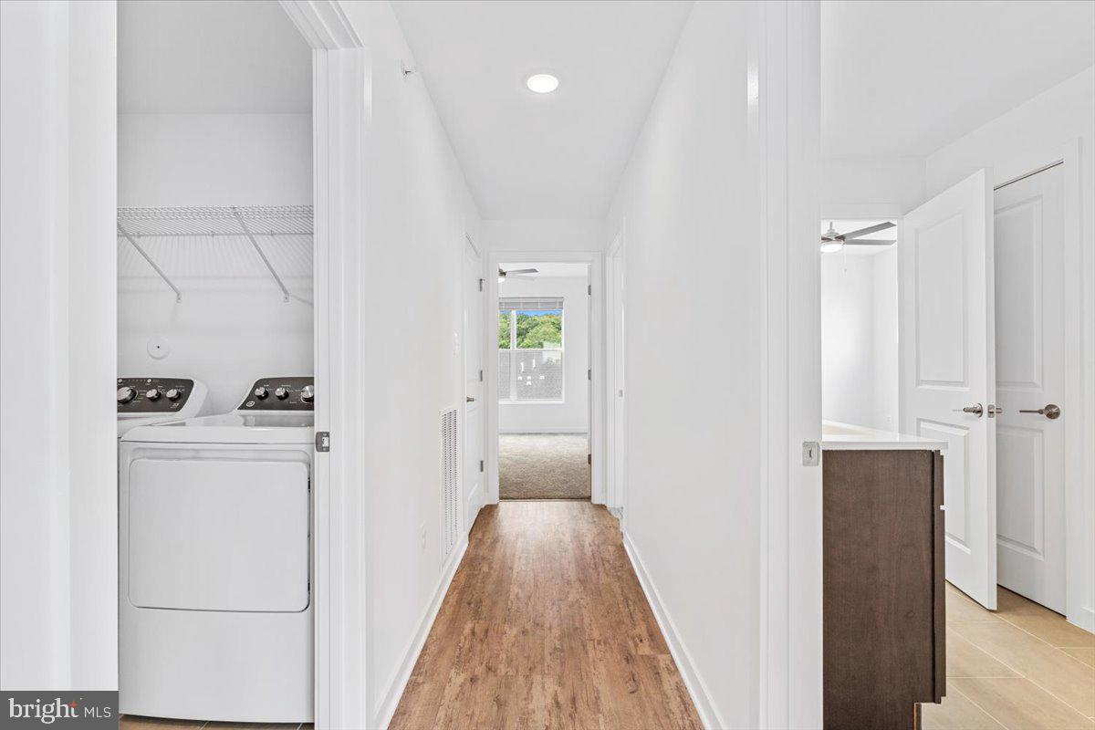 1618 A Blacksmith Way Frederick, MD 21702 - Photo 29 of 45 a view of hallway with wooden floor