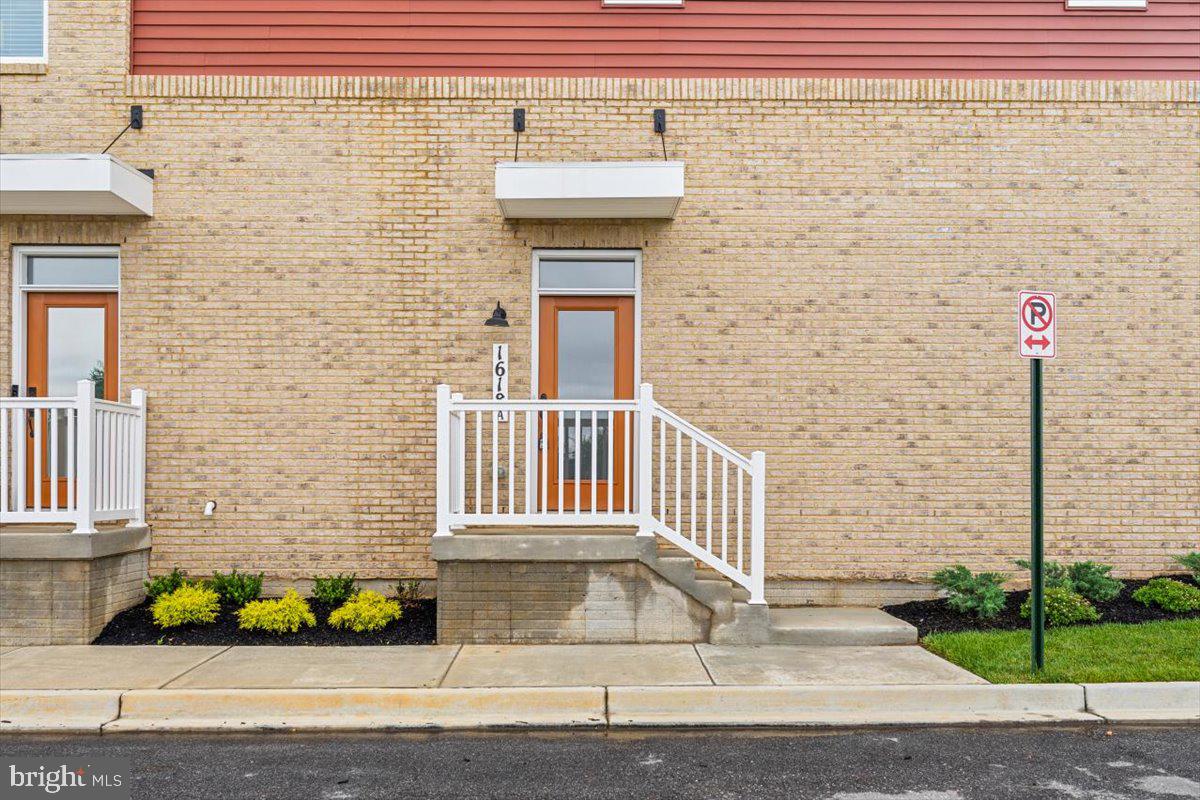 1618 A Blacksmith Way Frederick, MD 21702 - Photo 3 of 45 a front view of a house with a garden