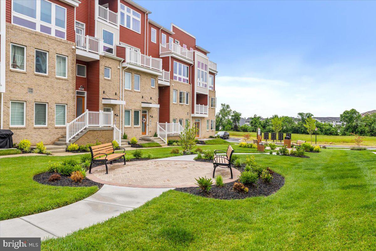 1618 A Blacksmith Way Frederick, MD 21702 - Photo 44 of 45 a front view of a building with garden and trees