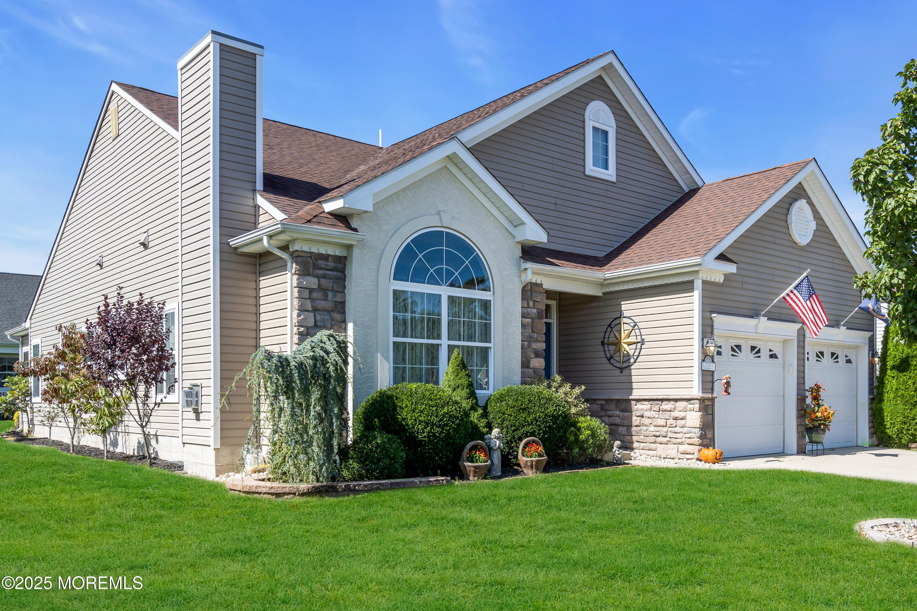 8 Ventnor Court Waretown, NJ 08758 - Photo 2 of 42 a front view of a house with a yard