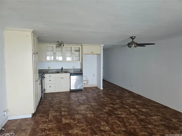 a kitchen with stainless steel appliances granite countertop a stove and a microwave
