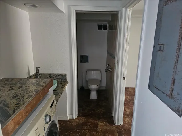 a bathroom with a toilet and a bathtub