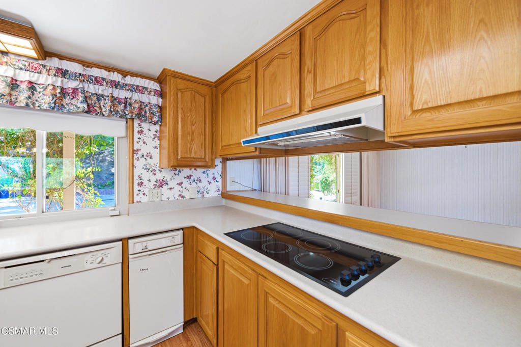 39 Inverness Road Thousand Oaks, CA 91361 - Photo 15 of 69 a kitchen with stainless steel appliances granite countertop a stove a sink and a microwave