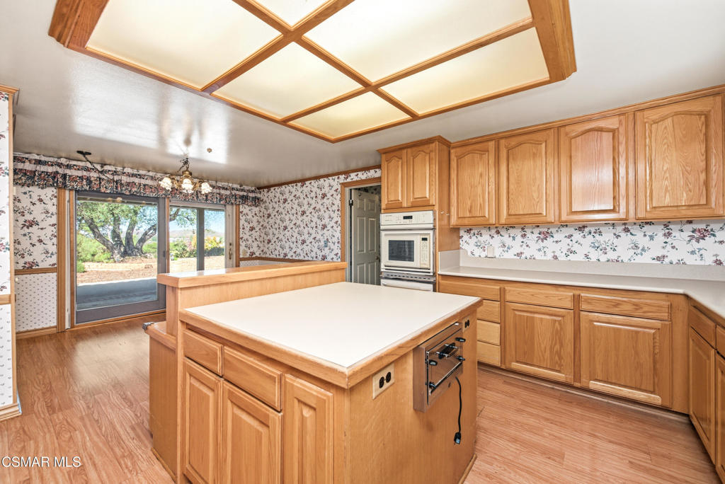 39 Inverness Road Thousand Oaks, CA 91361 - Photo 18 of 69 a kitchen with stainless steel appliances granite countertop a sink and cabinets with wooden floor