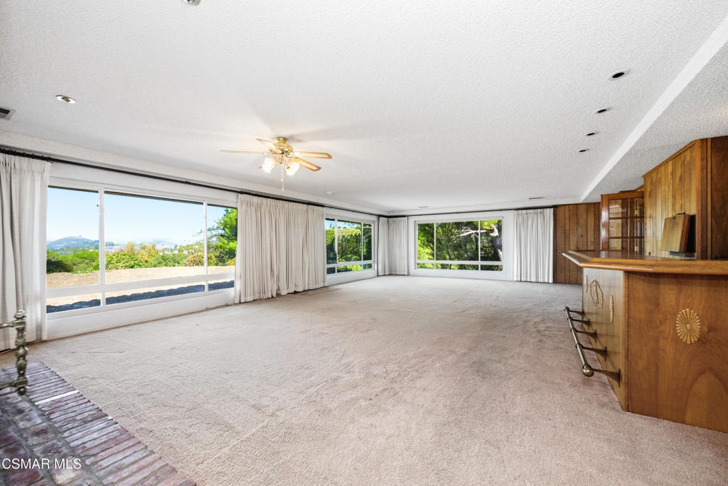 39 Inverness Road Thousand Oaks, CA 91361 - Photo 32 of 69 a view of a room with a fireplace and large windows
