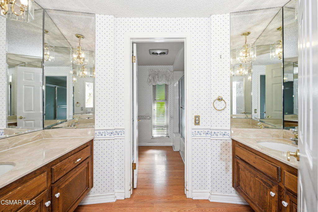 39 Inverness Road Thousand Oaks, CA 91361 - Photo 35 of 69 a bathroom with a sink a mirror and a shower