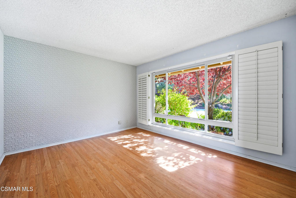 39 Inverness Road Thousand Oaks, CA 91361 - Photo 40 of 69 a view of an empty room with wooden floor and a window