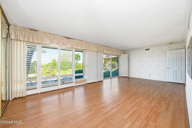 a view of backyard with a small yard