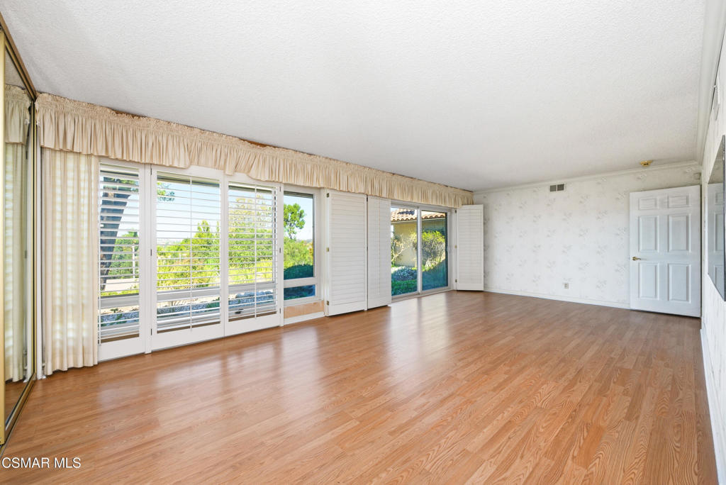 39 Inverness Road Thousand Oaks, CA 91361 - Photo 42 of 69 a view of an empty room with wooden floor and a window