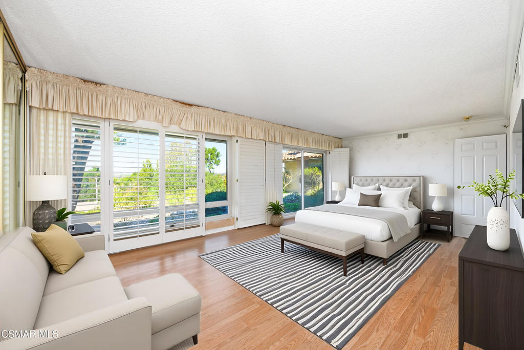 39 Inverness Road Thousand Oaks, CA 91361 - Photo 43 of 69 a spacious bedroom with a bed and a couch next to a window