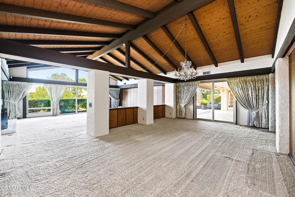 39 Inverness Road Thousand Oaks, CA 91361 - Photo 6 of 69 a view of an empty room with a fireplace and a large window
