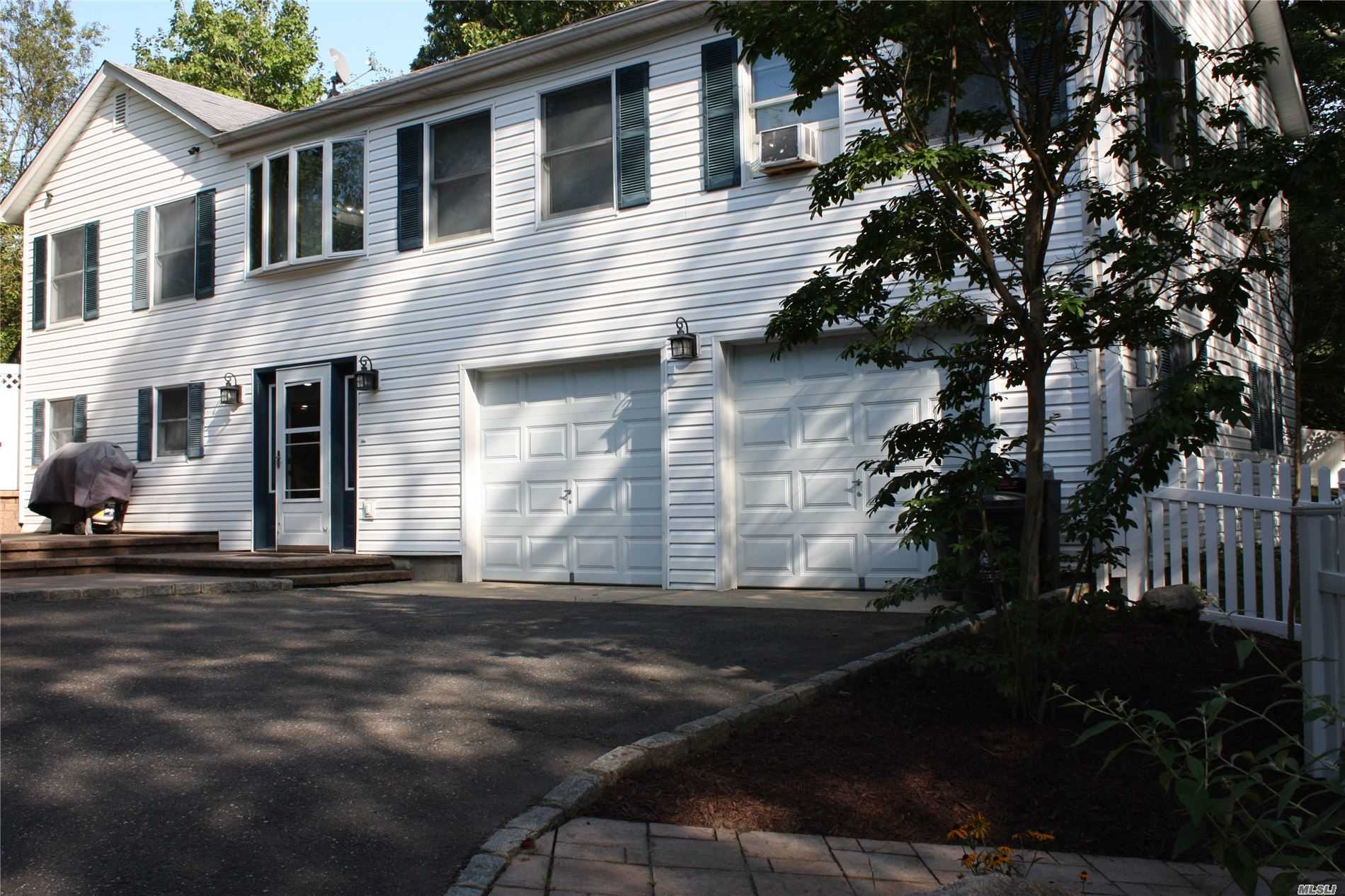 1 Manor Road Sound Beach, NY 11789 - Photo 1 of 1 a front view of a house with a yard