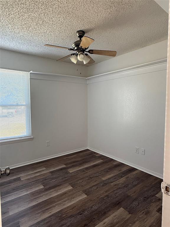 3757 Trinity Lane Abilene, TX 79602 - Photo 13 of 40 a view of an empty room with wooden floor and a window