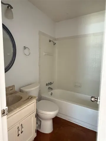 a bathroom with a toilet a sink and bathtub