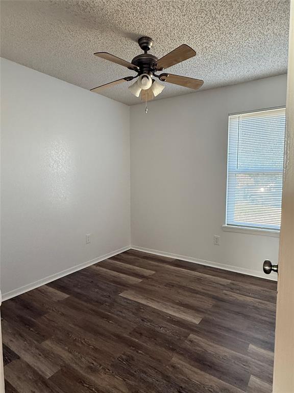 3757 Trinity Lane Abilene, TX 79602 - Photo 16 of 40 a view of an empty room with wooden floor and a ceiling fan