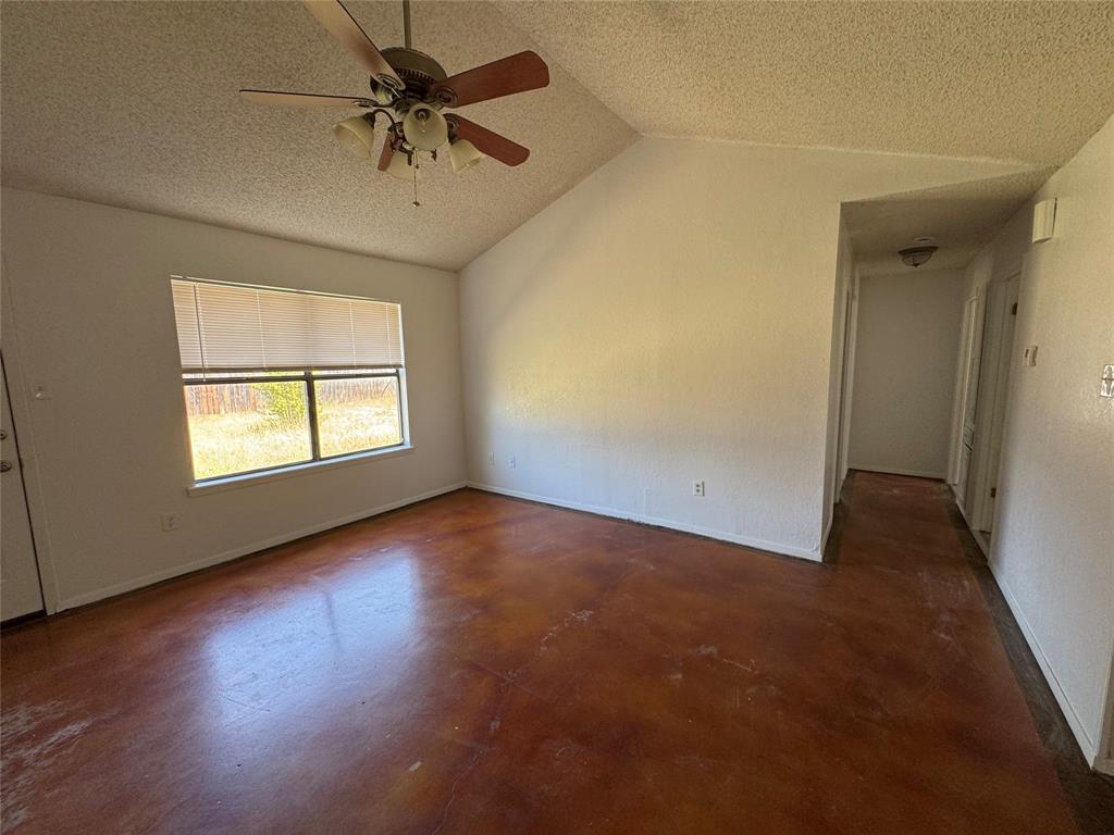 3757 Trinity Lane Abilene, TX 79602 - Photo 22 of 40 an empty room with a window and a ceiling fan