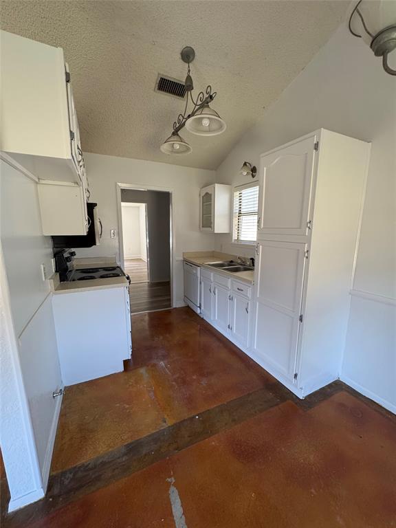 3757 Trinity Lane Abilene, TX 79602 - Photo 24 of 40 a kitchen with granite countertop a refrigerator and a stove top oven