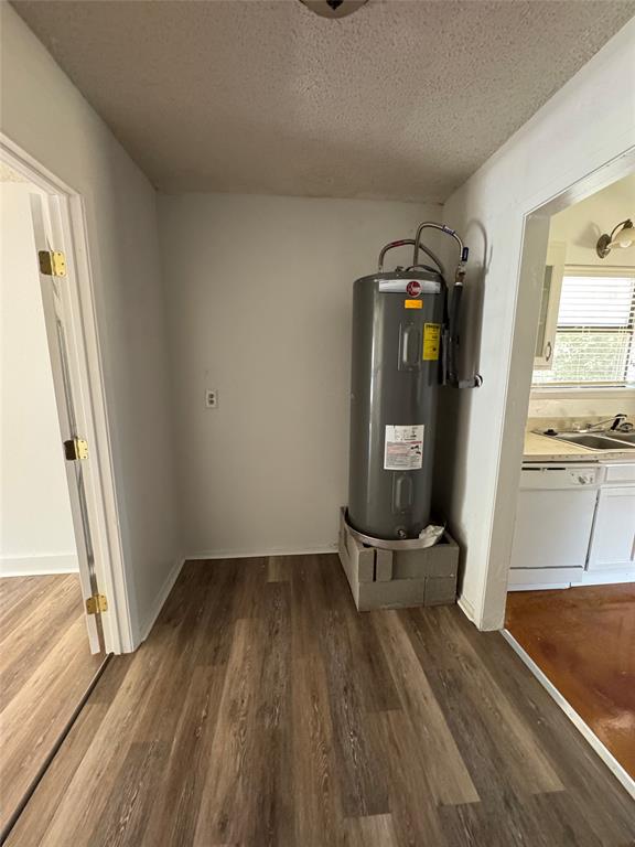 3757 Trinity Lane Abilene, TX 79602 - Photo 28 of 40 a view of a hallway with wooden floor and staircase