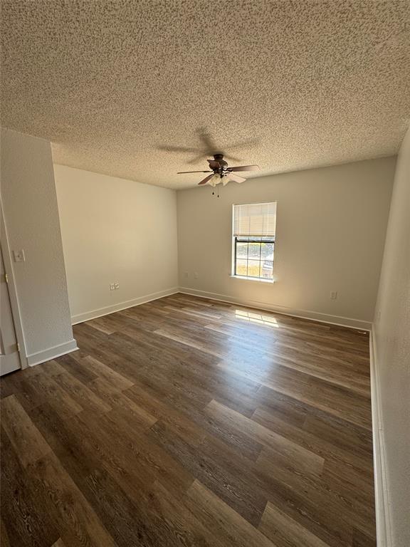 3757 Trinity Lane Abilene, TX 79602 - Photo 30 of 40 an empty room with wooden floor and windows