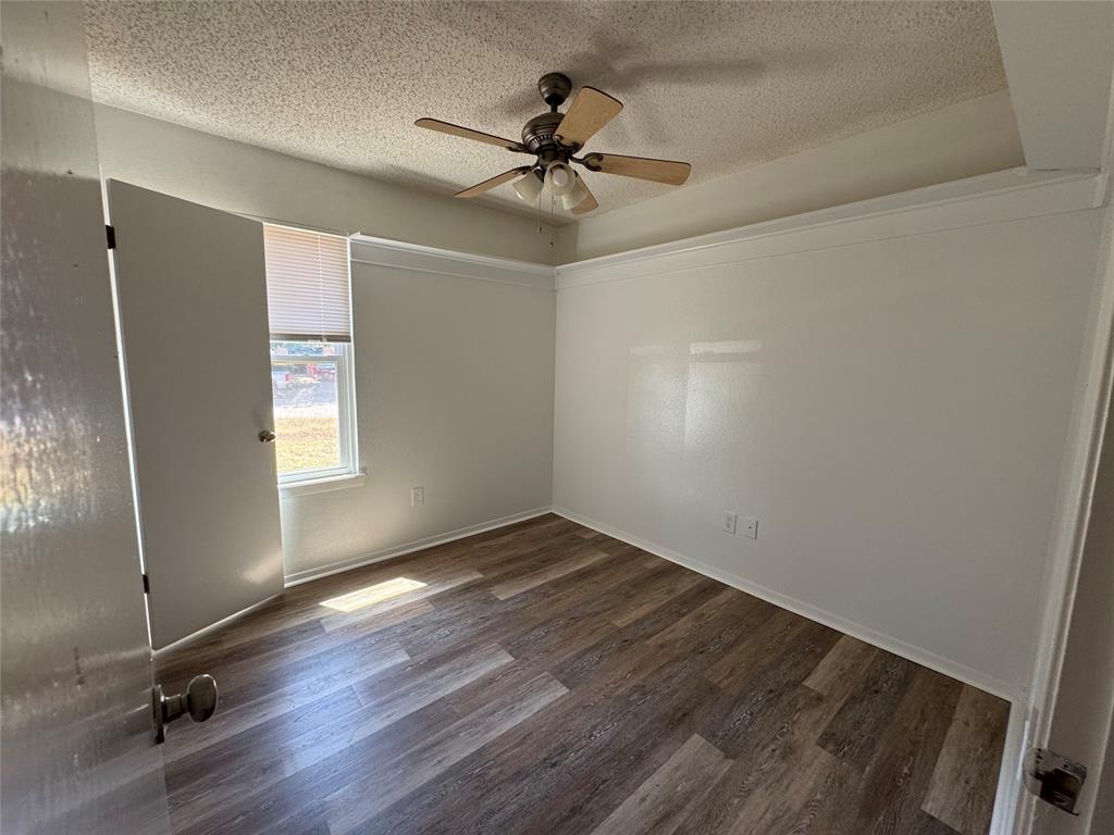 3757 Trinity Lane Abilene, TX 79602 - Photo 34 of 40 wooden floor in an empty room with a window